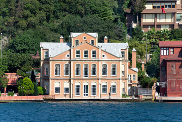 Fototapeta na wymiar View from Bosphorus strait of the green mountains of the Asian side, with traditional houses and dense trees in a summer day, Istanbul, Turkey