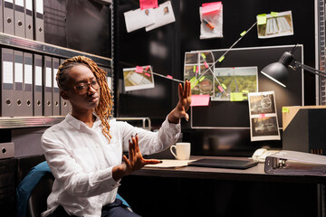 Private detective visualize crime case information in augmented reality. Police investigator using...