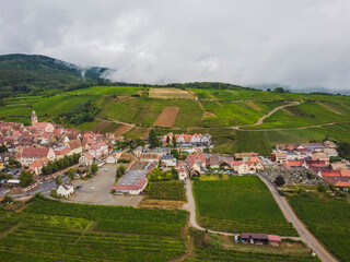 Aerial vIew by drone. Summer. France, Alsace. Riquewihr fortess town.