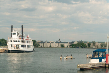 Fototapeta premium Tourist steamer in the evening on the pier