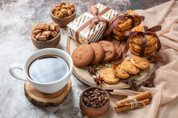 front view sweet biscuits with nuts and presents on light background color sugar tea cake cookie sweet pie pastry