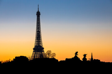 Paris, France - February 8, 2023: Skyline of Paris at sunset with Eiffel Tower silhouette