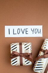 top view little presents on brown background marriage couple affection love passion gift color feeling