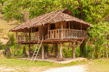 Fototapeta na wymiar Chiang Mai, Thailand. Tribal building raised on supports or stilts.