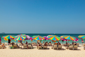 Fototapeta na wymiar Thailand, Phuket. Colorful umbrellas on the beach.