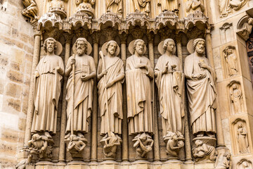 France, Paris. Front facade of Notre Dame. Statues of saints.