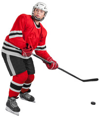 Young hockey player in Ice-skating equipment