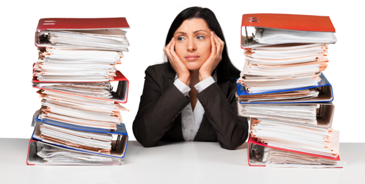 Portrait of a Bored Employee Behind a Stack of Folders Looking Up