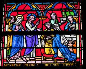Jesus blessing marriage stained glass, Notre-Dame of the Assumption, Sainte-Marie-du-Mont, Normandy, France. Church created 11th to 13th Century