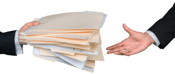 Closeup of Businesspeople Handing File Folders