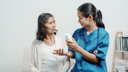 Senior older elderly patient asian grandmother woman with nurse consulting, safety and support of help, trust of breast cancer awareness, encourage