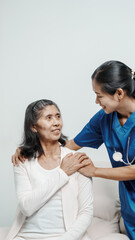 Senior older elderly patient asian grandmother woman with nurse consulting, safety and support of help, trust of breast cancer awareness, encourage