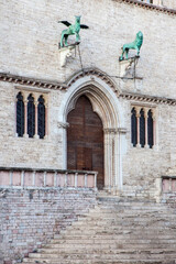 Italy, Umbria, Perugia. The facade and entrance of the Palazzo dei Priori fronting Piazza IV Novembre.