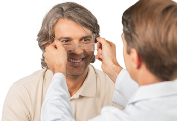 Young  man trying his new pair of glasses after the eye exam