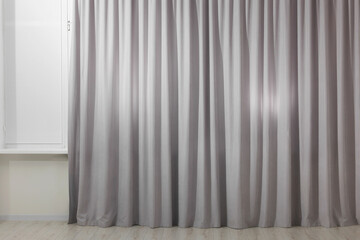 Light grey window curtains in living room