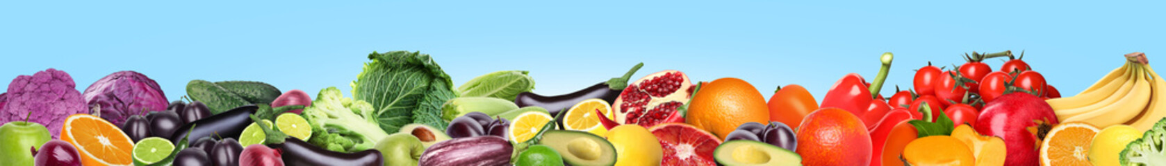 Many different fresh fruits and vegetables on light blue background. Banner design