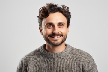 Obraz premium Portrait of a smiling young man in sweater, isolated on white background