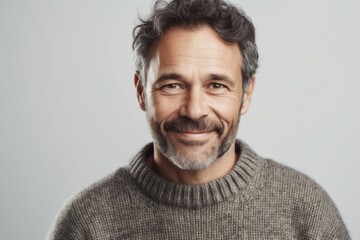 Obraz premium Portrait of a handsome middle-aged man in a grey sweater