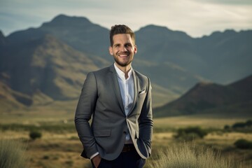Portrait Of A Young Businessman Smiling At The Camera In The Desert