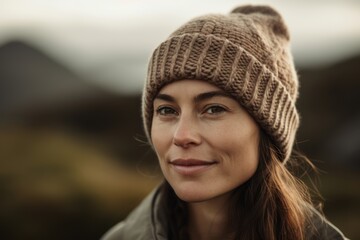 Portrait of a beautiful young woman in a knitted hat.