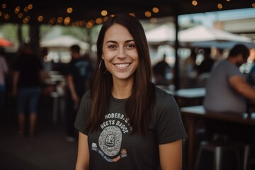 Portrait of a beautiful young woman smiling at the camera while standing in a coffee shop