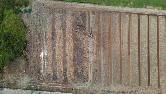 the aerial view of the excavator working on site 