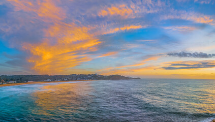 Sunrise at the seaside with an interesting high cloud structure