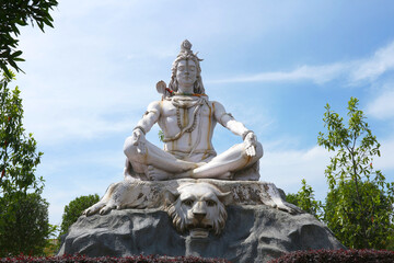 God Shiva meditates sitting on a tiger skin in Rishikesh, India.