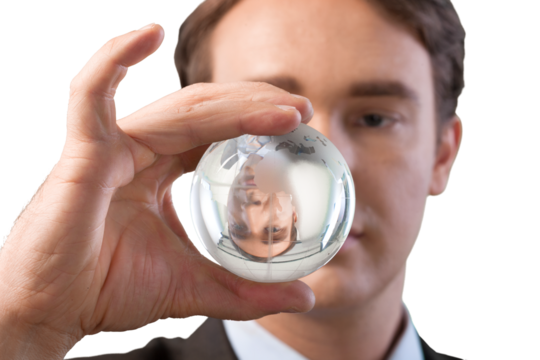 Businessman holding glass globe isolated on white background