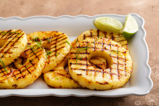 Grilled Pineapple With Lime Honey Glaze And Whipped Cream