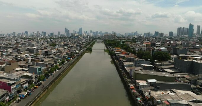 Aerial view of river Ciliwung in the city of Jakarta. City life. Indonesia.
