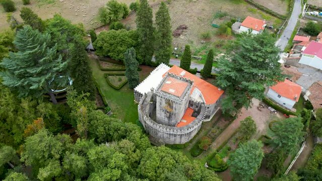 Aerial circling shot on castle of ferreira de panton with garden in lugo, spain.
