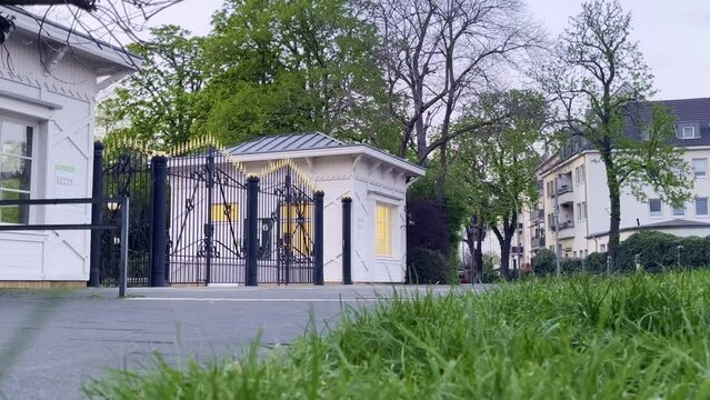Entrance to a park with black and gold noble gate