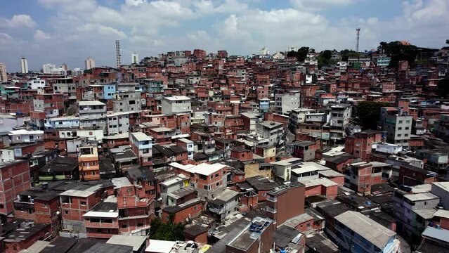 Aerial overview of ghetto homes in Jaguare, daytime in Sao Paulo, Brazil