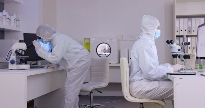 Medical, laboratory staff and safety gear while working on a scientist collaboration and research. Healthcare, dna search and microscope study in a lab with forensic team with science report planning