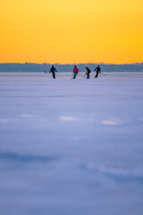 Fototapeta na wymiar Boys playing hokey on the frozen lake Monona Wisconsin