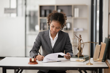 Lawyers Asiawoman   having through online Concepts  of Legal services at the law office.