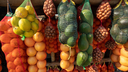 a roadside farmers market in South Africa displays fruits and vegetables for purchase. 