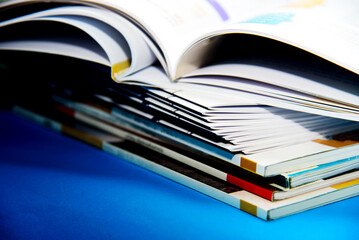 stack of books on blue background