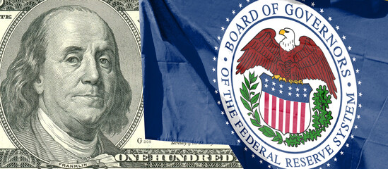 Close-up of Federal Reserve flag with 100 dollar bills. inflation. Rising interest rate conceptual image
