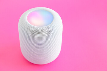 Modern music speaker on pastel pink background