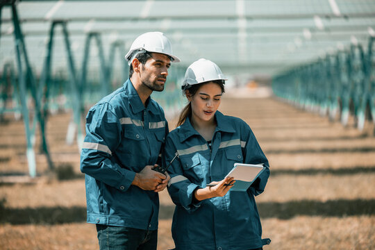 Solar design engineers visually inspect photovoltaic array installation sites for suitable alignment, surface, sunlight access, and structural stability. System maintenance and operation records.