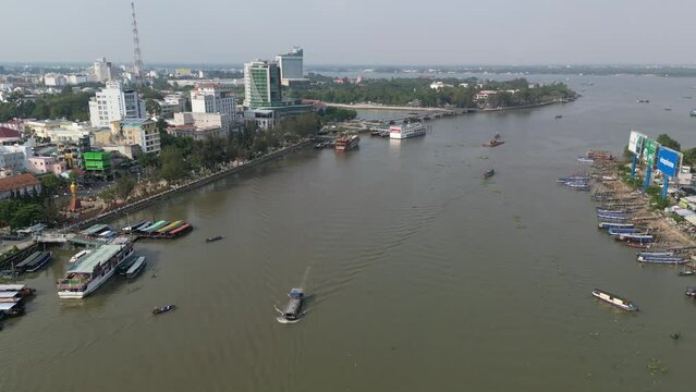 Drone footage above the Mekong river in Can Tho city, capital of Mekong Delta in south Vietnam. Camera moves foward above the river 1-2
