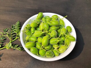 Fresh green chickpeas pod. chickpea is an annual legume of the Fabaceae family.
Chickpea seeds are high in protein. Its other names Bengal gram,garbanzo,garbanzo bean, Egyptian pea. 