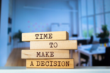 Wooden blocks with words 'Time to make a decision'. Business concept