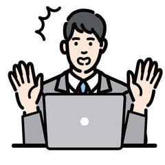 ラップトップの前で驚いているスーツを着た若い男性
