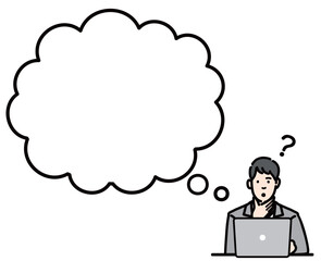 吹き出し　ラップトップの前で考えているスーツを着た若い男性
