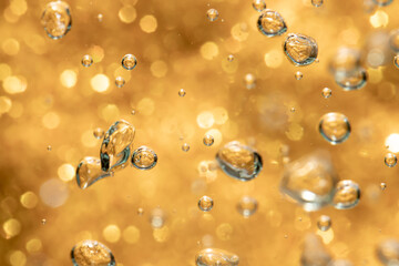 Golden abstract sparkles or glitter lights Defocused circles bokeh