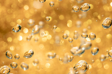 Golden abstract sparkles or glitter lights Defocused circles bokeh