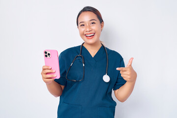 Cheerful young Asian woman professional nurse working wearing a blue uniform holding mobile phone...